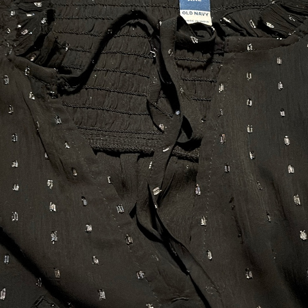 Black sparking blouse with all of the buttons